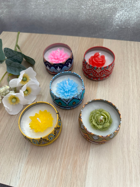 Container candles with flowers