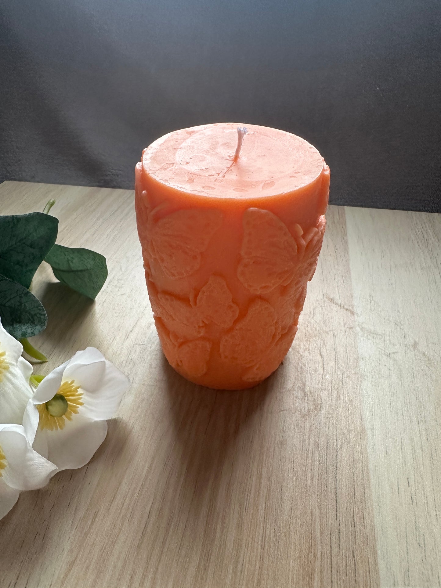 Cylinder candle with butterflies