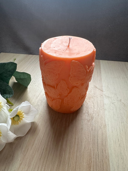 Cylinder candle with butterflies