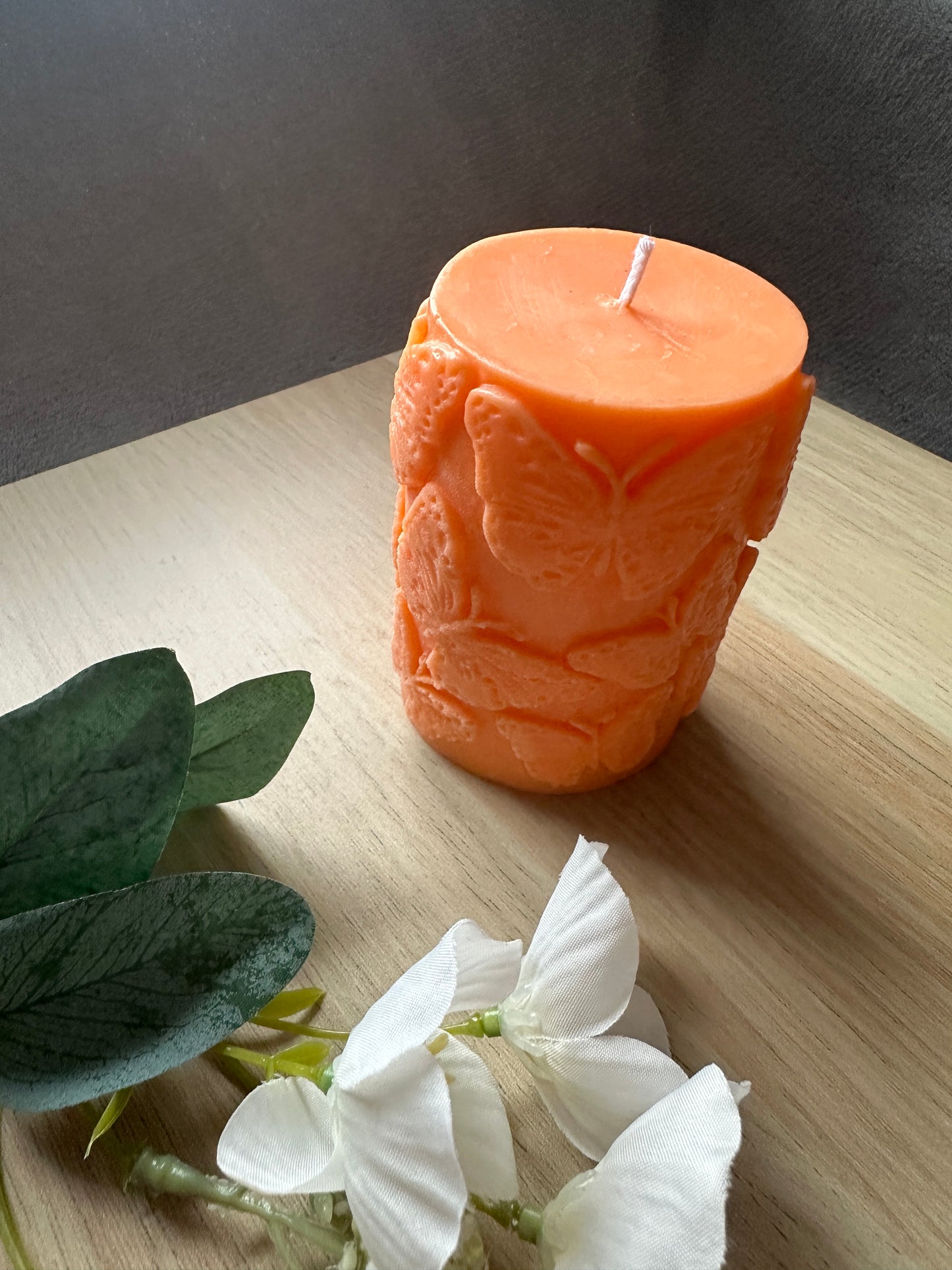 Cylinder candle with butterflies